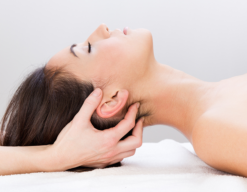 Woman enjoying massage at beauty spa